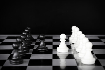 chess game.business leader concept.Selective focus.on a dark background.