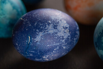 Colored Easter eggs on a dark background. Christian Easter