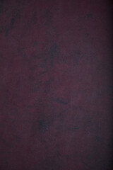 Deep burgundy texturedgrunge background. Place for text.