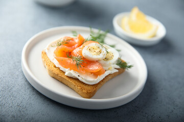Salmon toast with quail eggs and dill
