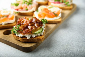 Homemade bacon sandwich with cream cheese and cucumber