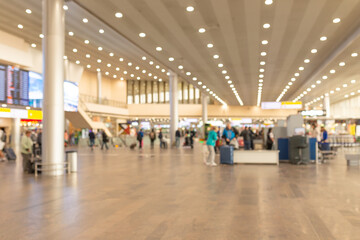 Fototapeta na wymiar Abstract background. Blurred image of aeroport interior. Out of focus photo of high-tech building