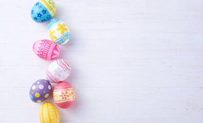 Happy Easter day eggs on wood background with copy space