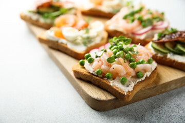 Shrimp toast with cream cheese, radish and green pea