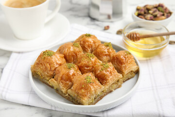 Delicious sweet baklava on white marble table