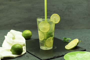 Cool drink Mojito in a glass glass on a dark background