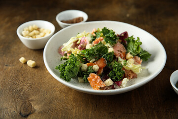 Kale salad with hot smoked salmon