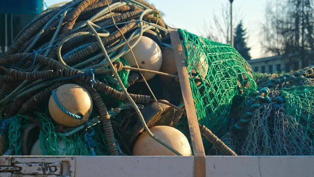 Pile of Tangled Up Professional Nylon Fishing Net with Buoys and Markers