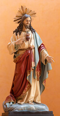 BARI, ITALY - MARCH 3, 2022: The carved polychrome statue of Heart Jesus to St. Theresa of Avila in...