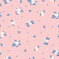 Seamless vintage pattern. small white flowers and dots, blue leaves. pink background. vector texture. fashionable print for textiles, wallpaper and packaging.