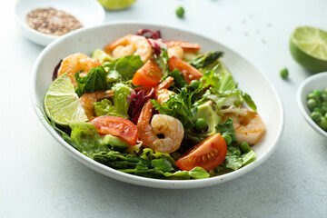 Healthy green salad with shrimps and avocado