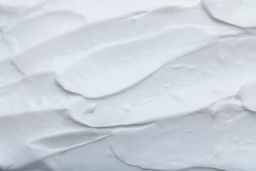 Fototapeta na wymiar Closeup view of white body cream as background
