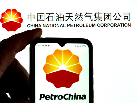 In this photo illustration, the PetroChina logo is displayed on a smartphone screen with a China National Petroleum Corporation logo in the background