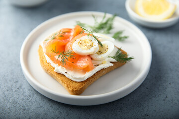 Salmon toast with quail eggs and dill