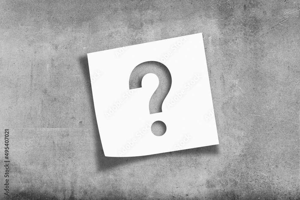 Poster note paper with question mark on textured concrete wall background