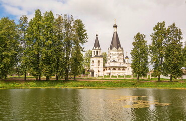 Fototapeta na wymiar Landscape with an old Orthodox church on the river bank
