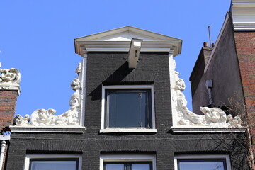 Fototapeta na wymiar Amsterdam Haarlemmerstraat Street Black Neck Gable Close Up, Netherlands