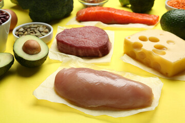 Set of products rich in amino acids on yellow background