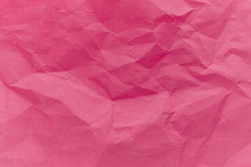 Fototapeta premium The crumpled pink paper texture