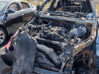 City car burned. Burnt out car.
