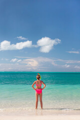 Barefoot young Caucasian female with snorkel equipment Caribbean
