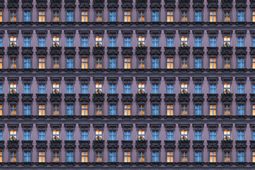 architectural pattern, beautiful pink facade of a berlin old building with illuminated windows