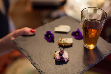Tea served with cheese crackers and flowers 