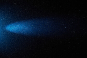 On a dark blue gradient background, a blue ray of light