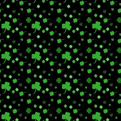 Vector St. Patrick's day seamless pattern with green shamrock leaves on a white background.