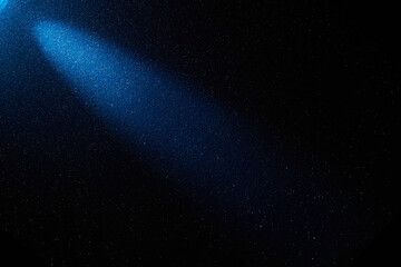 On a dark blue gradient background, a diagonal light blue beam of light