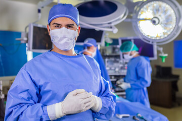 Portrait of male doctor in PPE operating theatre