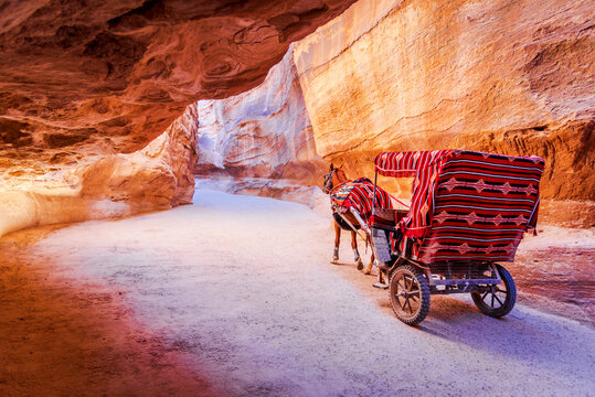 Petra, Jordan - Siq canyon and horse cart for tourists, Arabia.