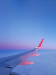 Airplane wing in the blue sky © kos1976