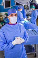 Fototapeta na wymiar Portrait of male doctor in hospital sterile scrub