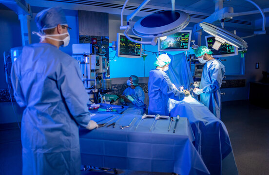 Hospital Operating Theatre medical team performing laparoscopic surgery