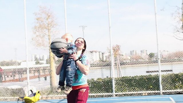 Mom And Baby Play Basketball, Little Boy Plays Ball With Mom