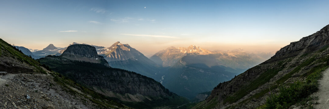 Panorama of The Western Mountains In Glacier With McDonald Creek Flowing In The Valley