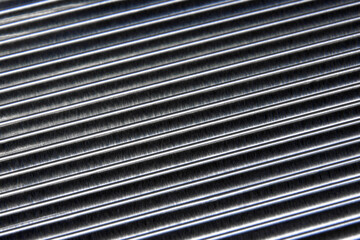 shiny waves of metal. bent aluminum foil. macro photo of corrugation