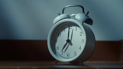 Alarm clock on the bedside table close-up.