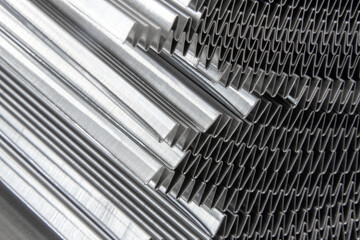 shiny waves of metal. bent aluminum foil. macro photo of corrugation