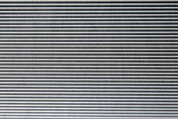 shiny waves of metal. bent aluminum foil. macro photo of corrugation