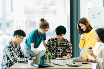 Asian Business People Analyzing Statistics Financial Concept.