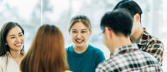 Fototapeta premium Group of asian young creative happy enjoy laugh smile and great success emotion teamwork people business startup entrepreneur casual brainstorm business meeting office background