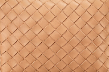 Texture of braided genuine leather of excellent workmanship in a rich beige color. A great background for the banner. Horizontal arrangement. - 495429618