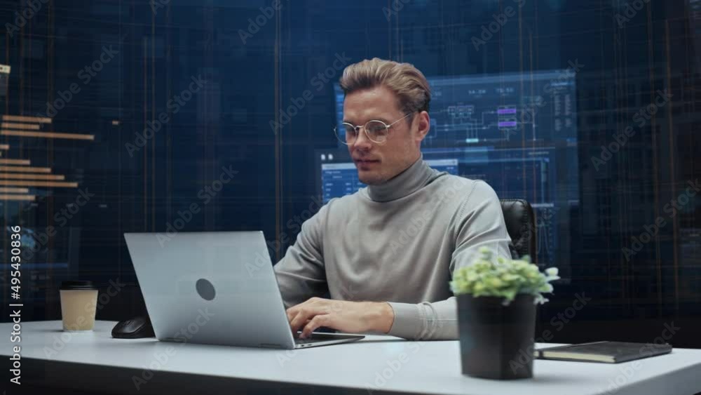 Poster office manager with animated virtual background: businessman sitting at a desk working on a laptop c