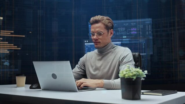 Office Manager with Animated Virtual Background: Businessman Sitting at a Desk Working on a Laptop Computer. Man Working with Big Data Finance Analysis. 360 Degree Tracking Shot. Camera Moving Around.
