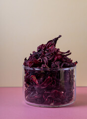 herbal tea, dry hibiskus flower, immune booster in color background © Larisa