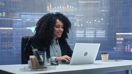Office Manager with Animated Virtual Background: Businesswoman Sitting at a Desk Working on Laptop Computer. Black Female Working with Big Data Finance Analysis. 360 Degree Shot. Camera Moving Around.