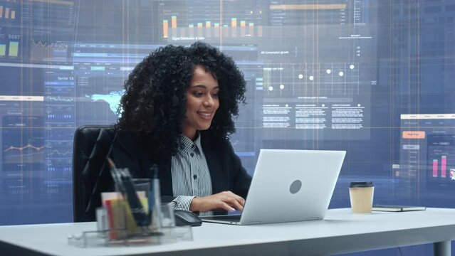 Office Manager with Animated Virtual Background: Businesswoman Sitting at a Desk Working on Laptop Computer. Black Female Working with Big Data Finance Analysis. 360 Degree Shot. Camera Moving Around.