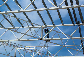 Industrial construction site, builder profession background. High-rise metal frame